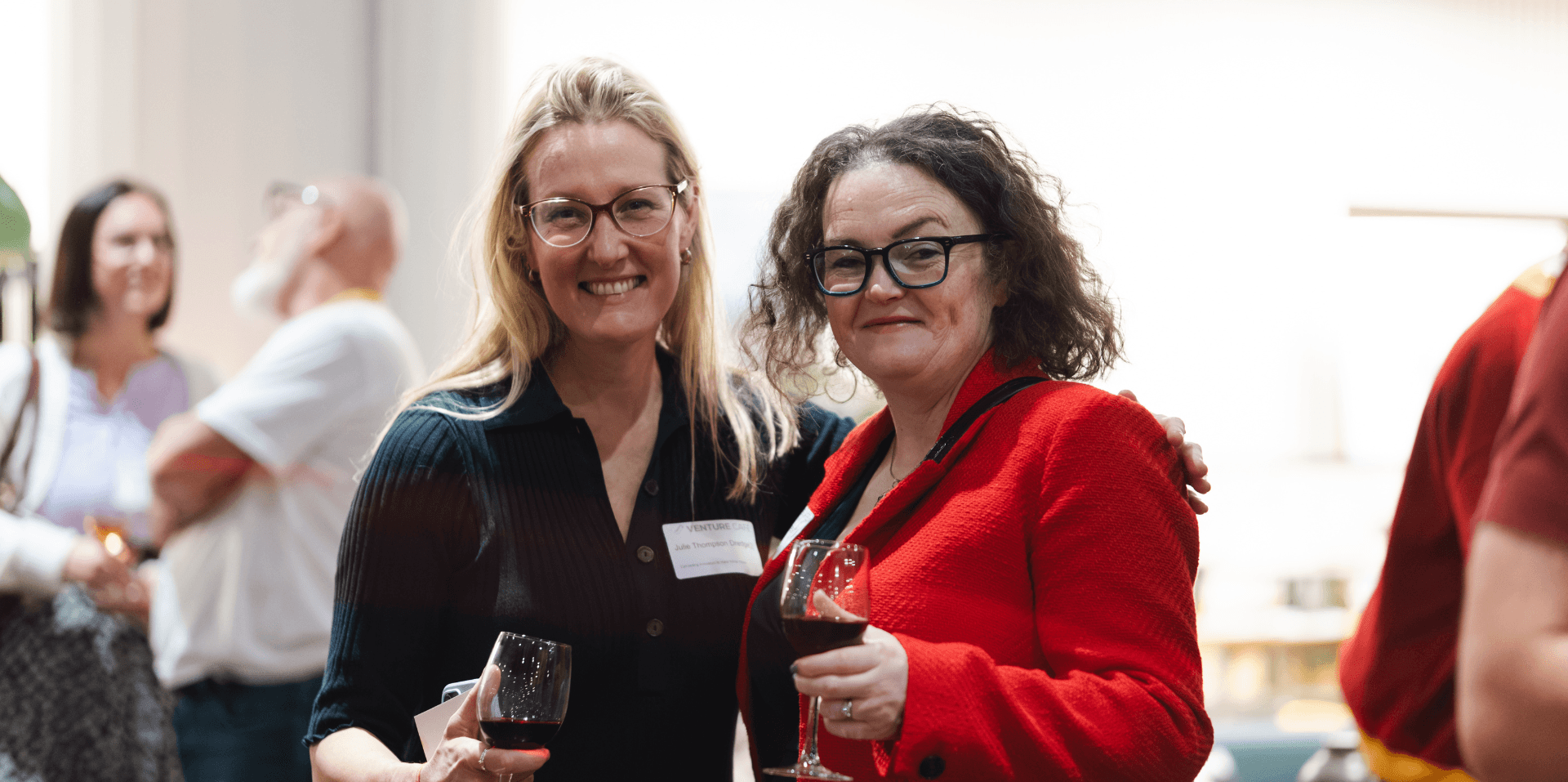 Two women look joyfully into the camera lens