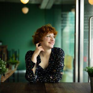 Ginger hair lady looking out of window