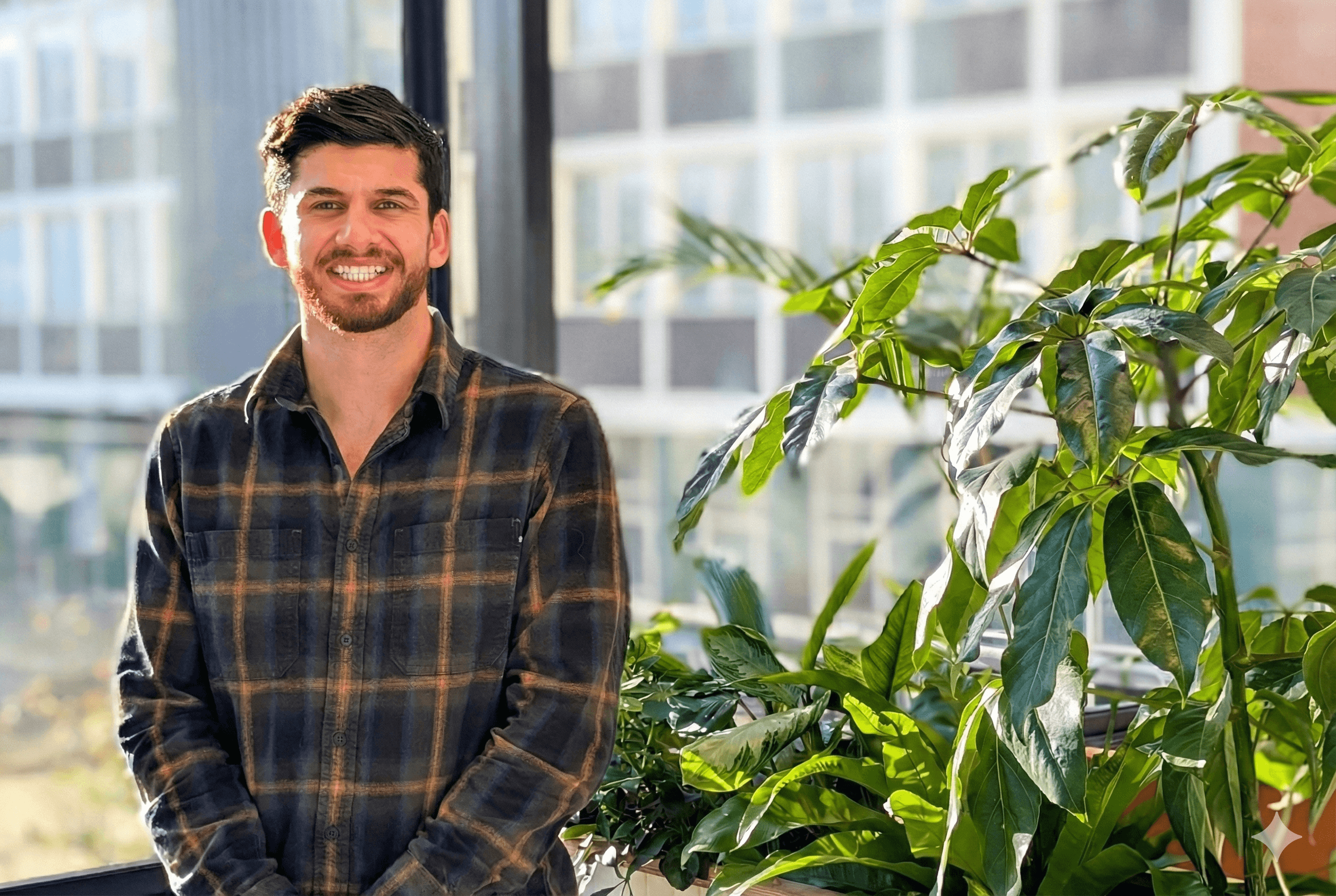 Man with checked shirt smiling 