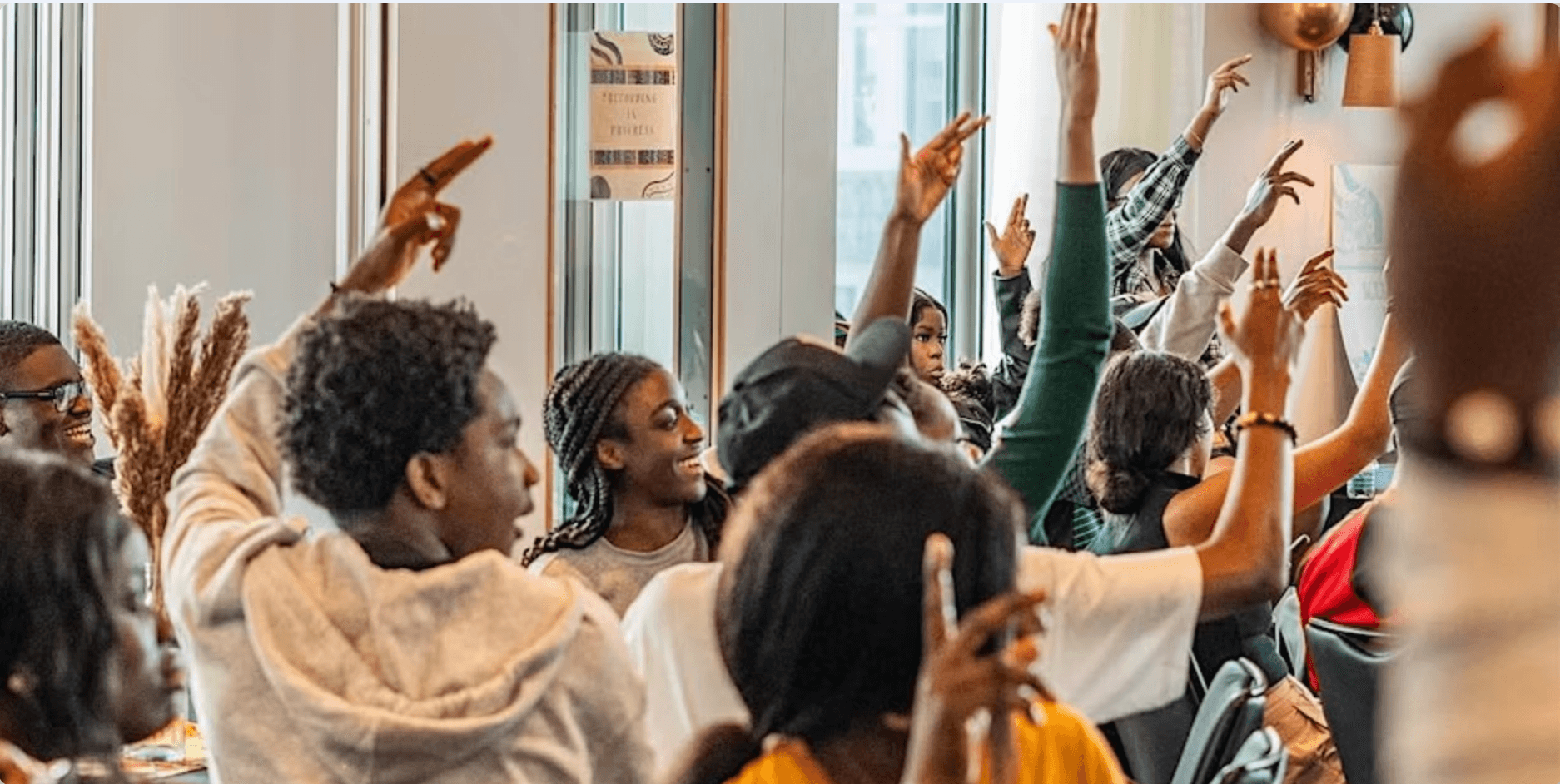 Young people with hands up 