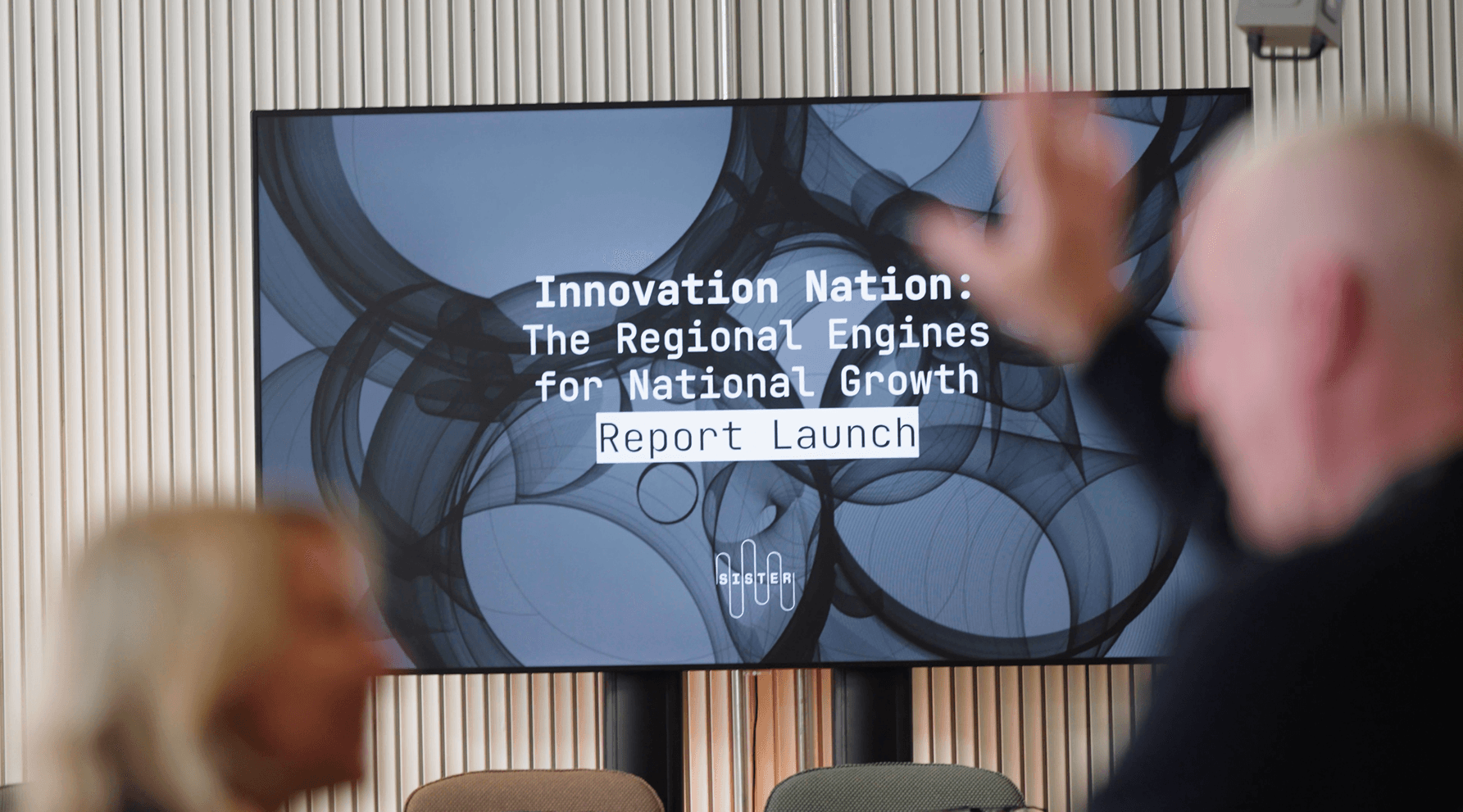 Tv screen with Innovation Nation report launch graphic on 