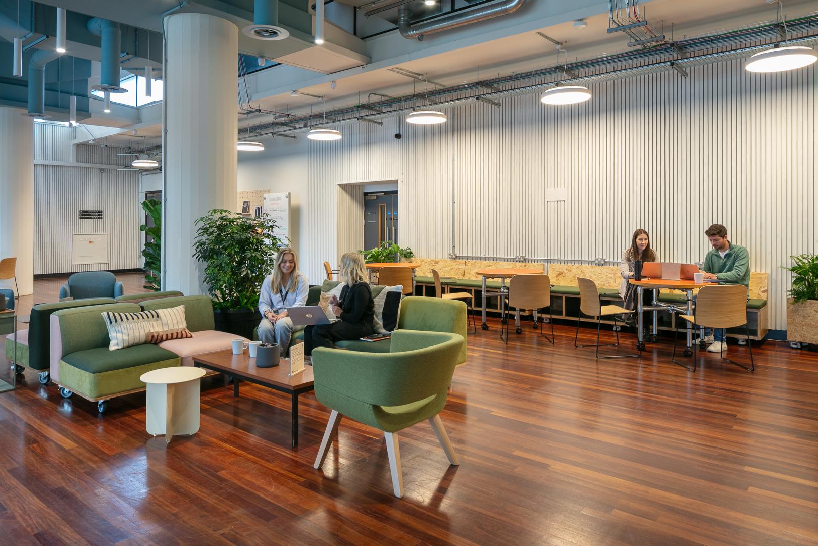 Groups of people meeting in the cafe space at Renold