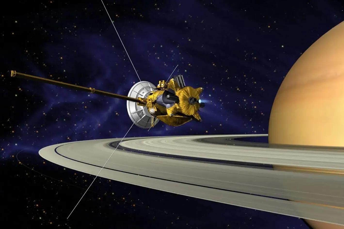 Image shows Saturn and its rings being followed and monitored by a space craft. 