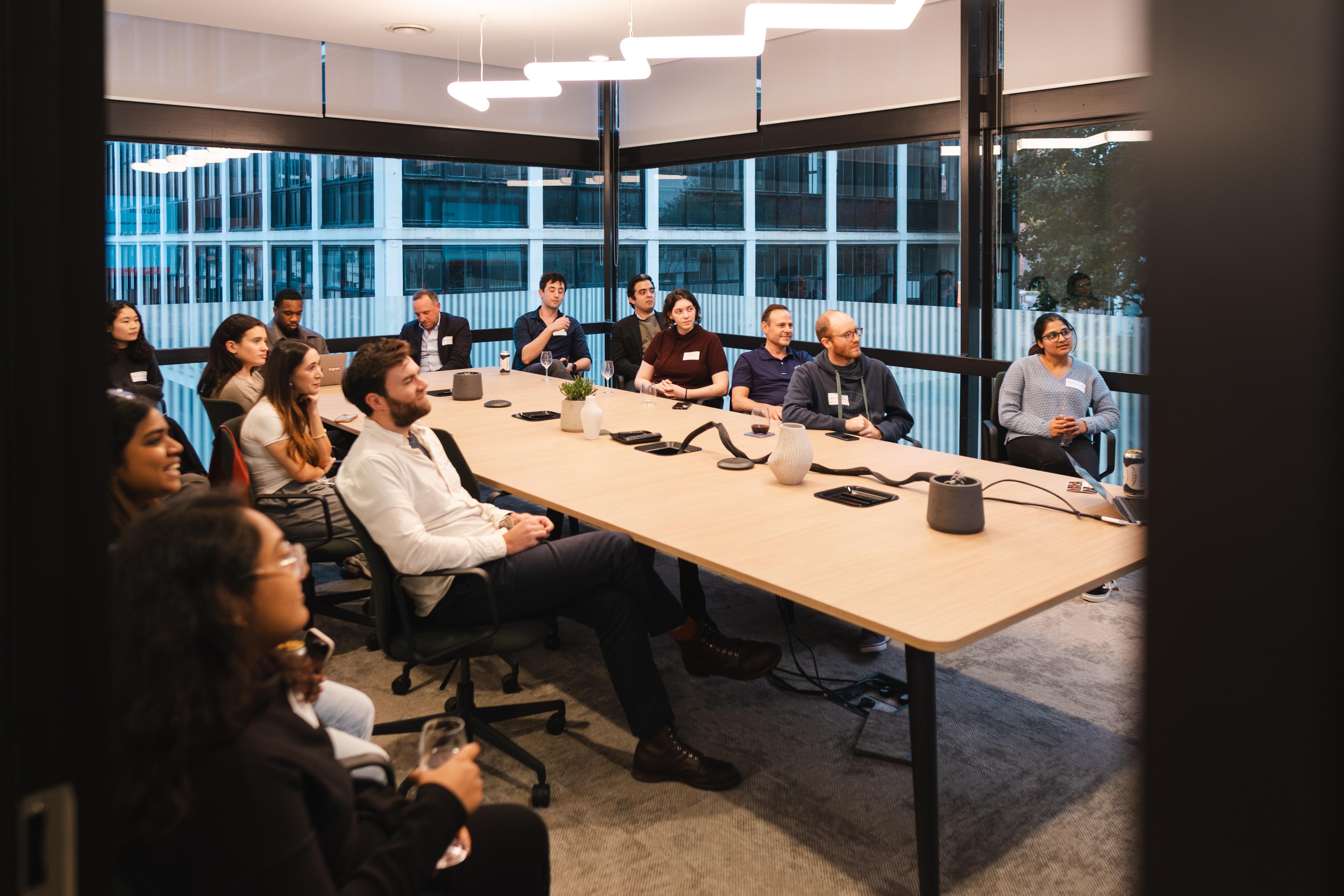 people seated at a table doing a workshop 