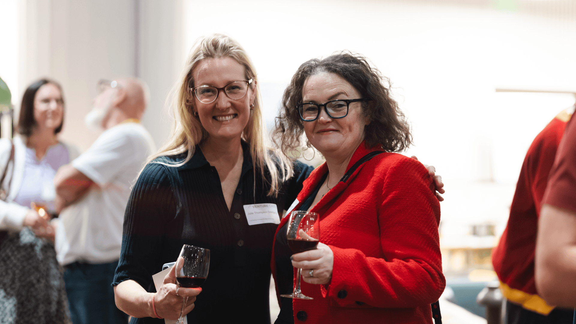 Two women look joyfully into the camera lens