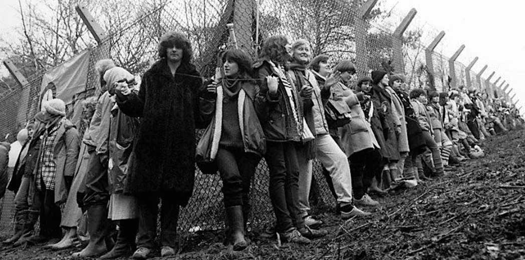 Black and White image of women together protesting 
