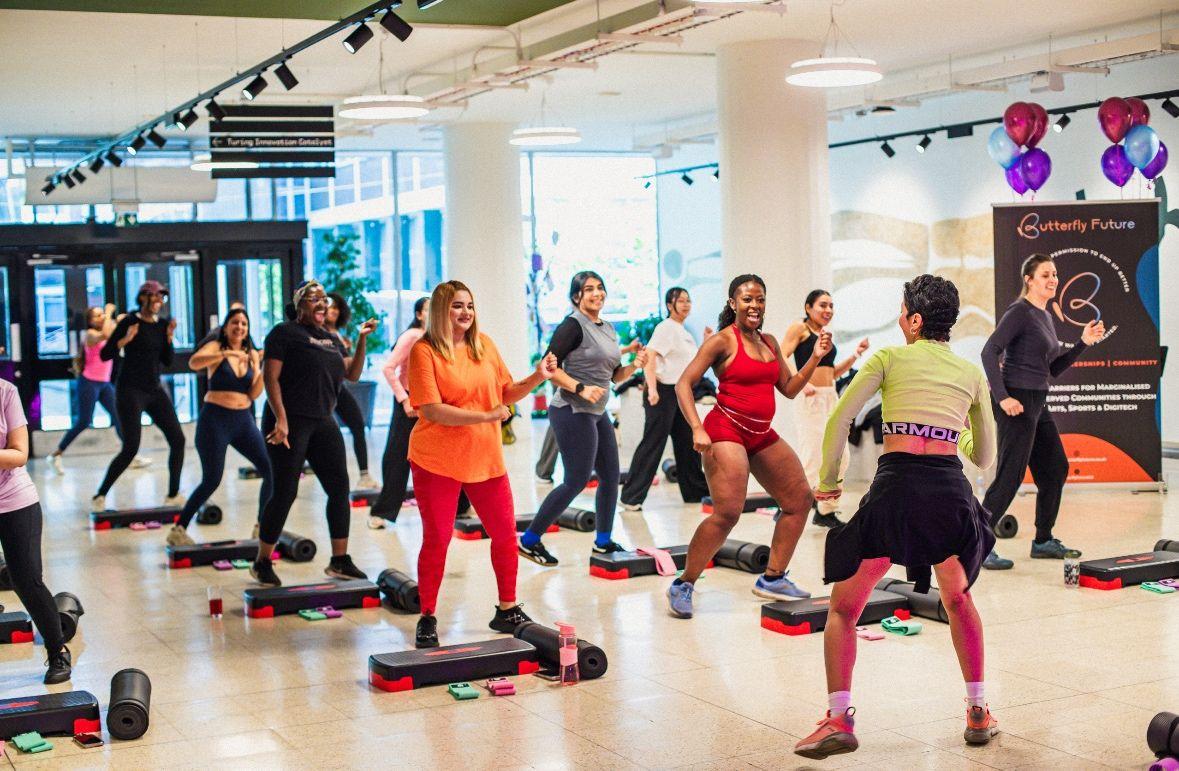 Group of ladies doing a workout class on the LG floor